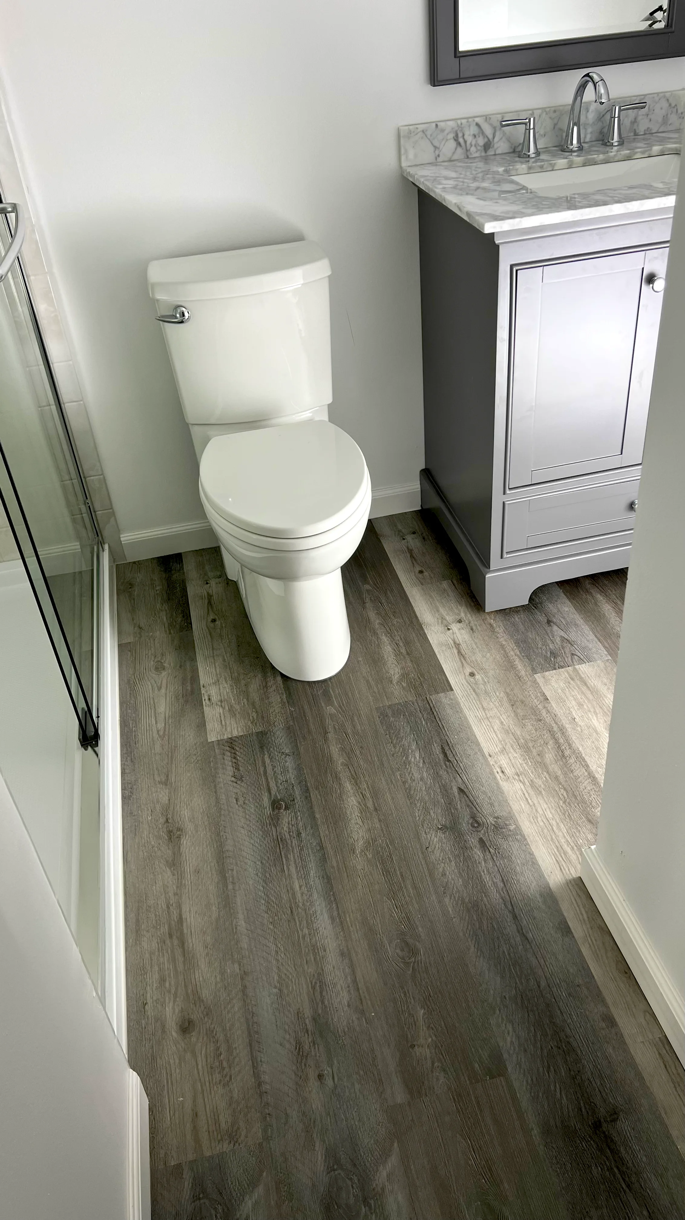 Vanity and tiled floor in a finished bathroom